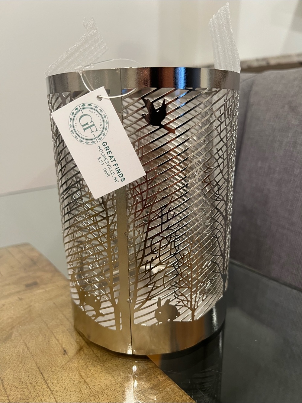 silver-toned finish with an intricate woodland silhouette scene Candle Holder